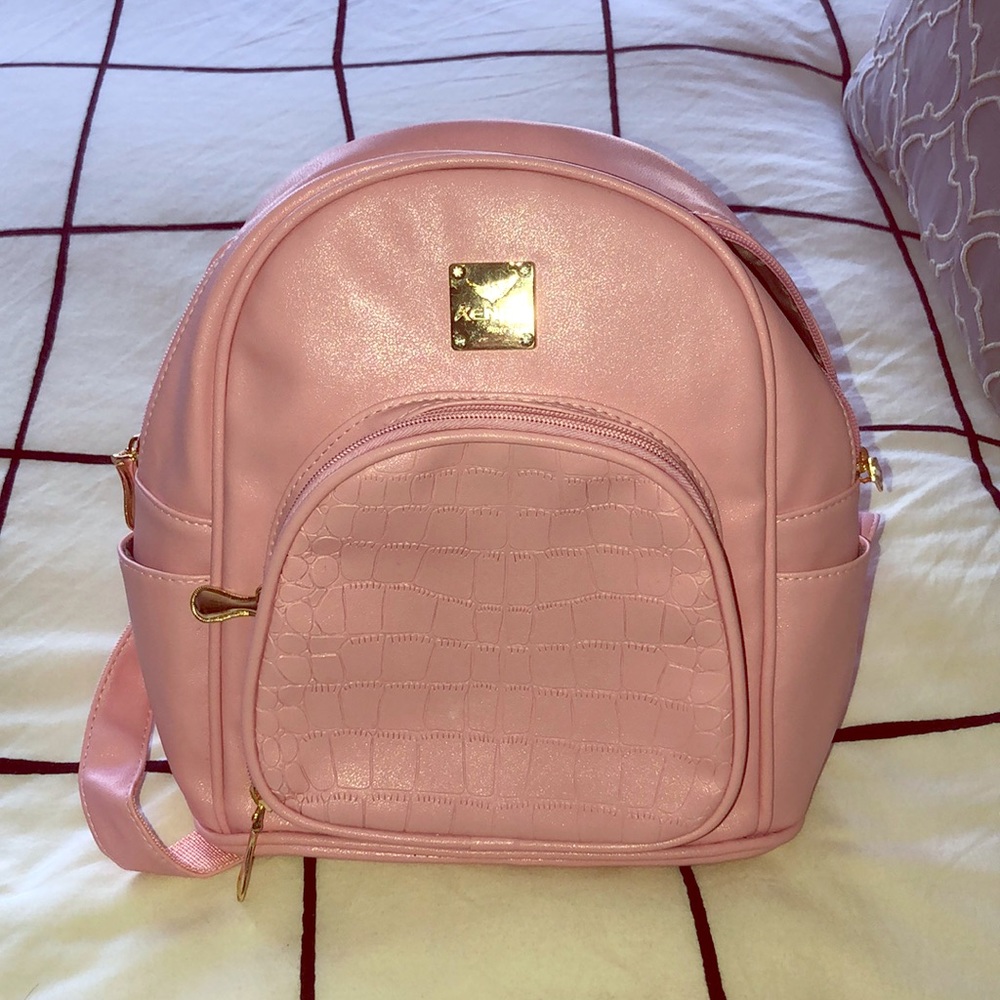 bubblegum pink tote bag/backpack.